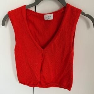 red sweater vest
